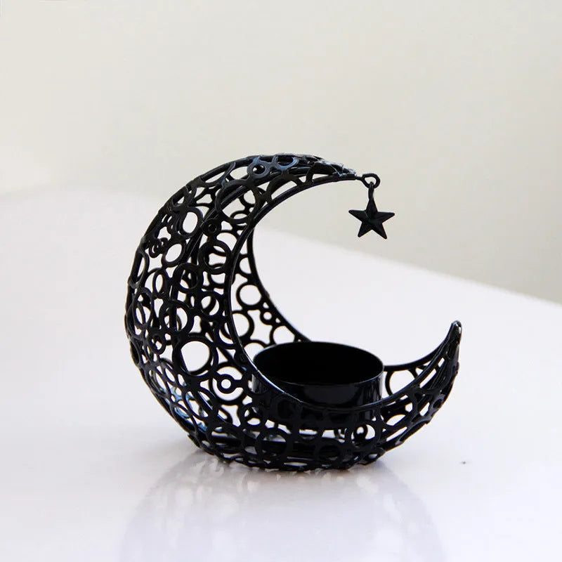 Metal crescent moon candle holder for tealight candles in black or gold colour on desktop