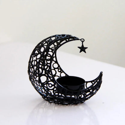 Metal crescent moon candle holder for tealight candles in black or gold colour on desktop