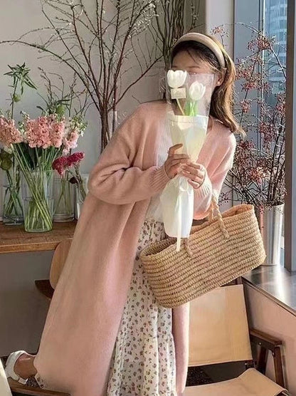 Women's knitted cardigan with V-neck and long sleeves in khaki colour, showing mid-length design