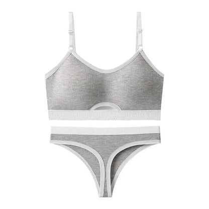 White underwired sports bra set with contrast dark grey back detailing and matching briefs on a mannequin.