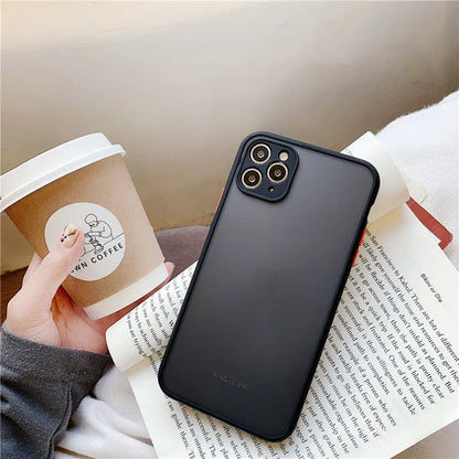 Solid colour silicone shockproof protective case for iPhone models on a table.