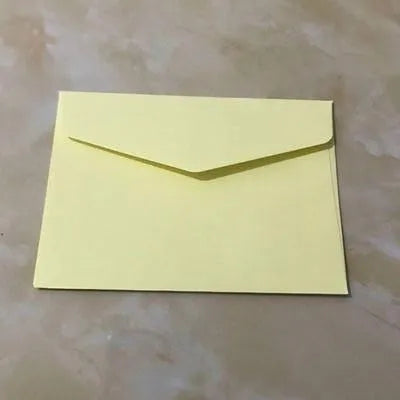Mini coloured paper envelopes in various hues measuring 11.5 by 8 centimetres