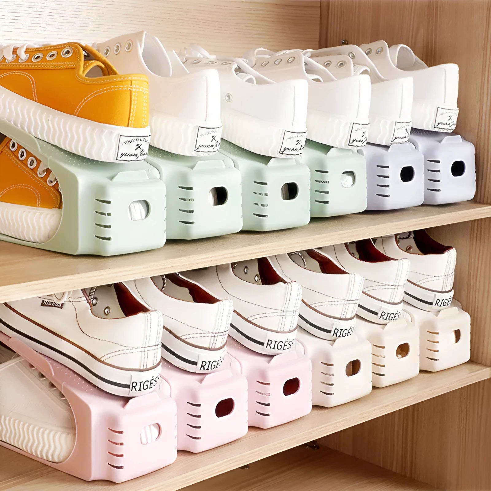 A stackable plastic shoe storage cabinet with two open shelves, shown in a choice of colours.