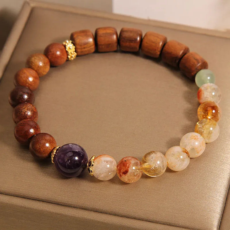 Women's crystal bracelet with yellow tower crystal, ebony amethyst beads, pearl and rhinestone decoration