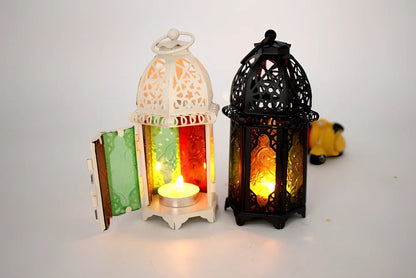 Wrought iron candle holder with 16cm height and 7cm diameter in black finish showing hanging design