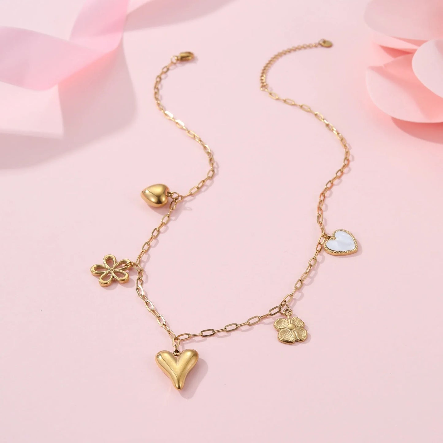 Stainless steel necklace with a geometric sun pendant on an adjustable chain.