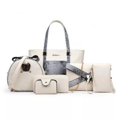 Women's shoulder bag with zipper closure and multiple pockets in light grey, black, off-white, and rose red