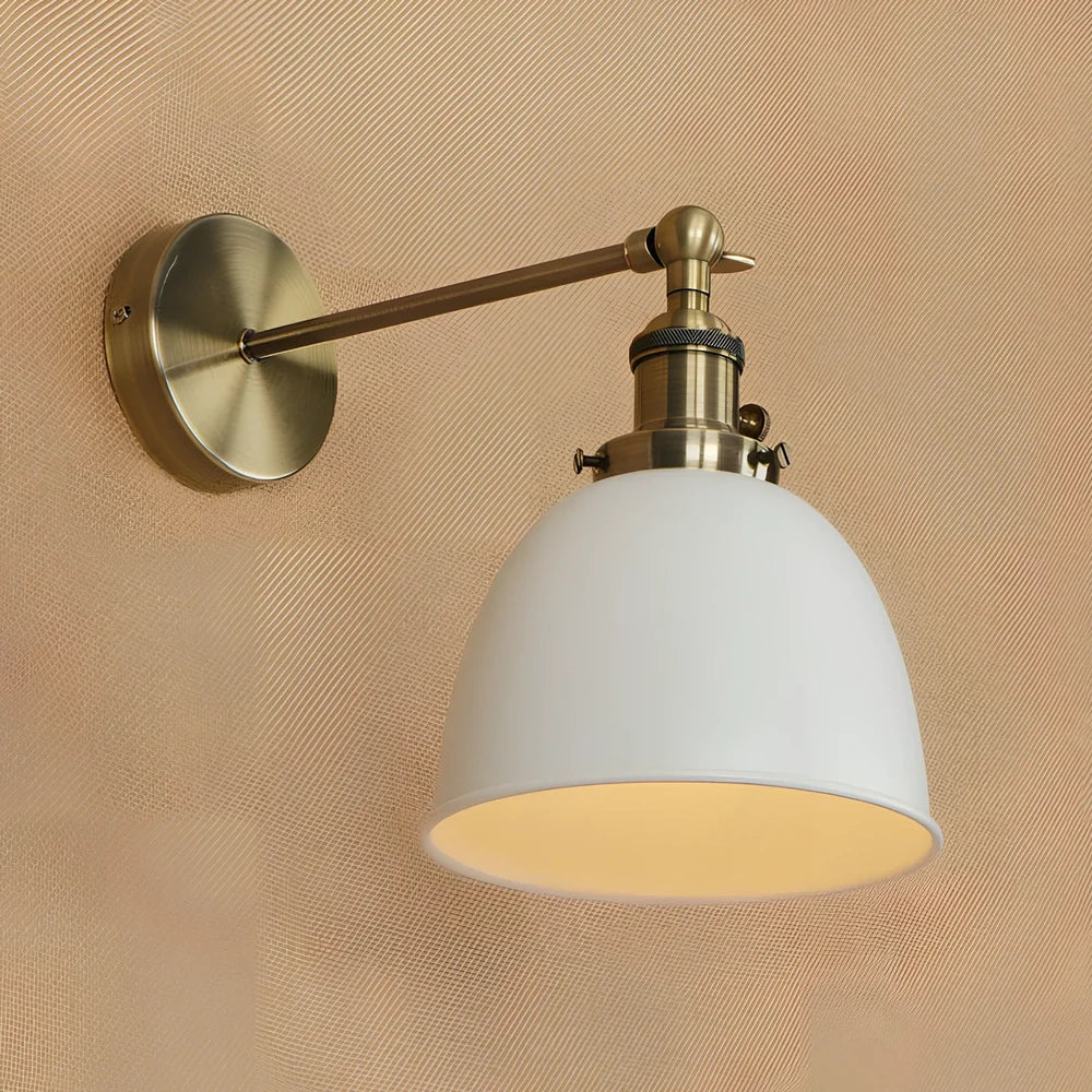 Bedroom wall light with 15cm wide iron shade in pink colour, mounted 20cm projection for soft illumination