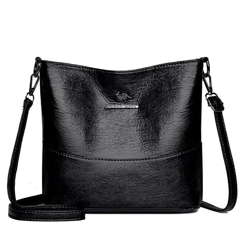 Women's soft leather bucket shoulder bag in black, wine red, or ginger yellow with large capacity and minimalist design