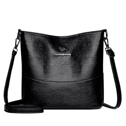 Women's soft leather bucket shoulder bag in black, wine red, or ginger yellow with large capacity and minimalist design