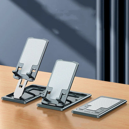 Aluminum alloy mobile phone stand in grey, rose gold, silver, and blue, adjustable angle for desktop use