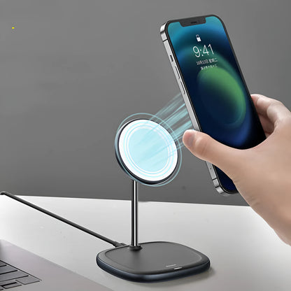 Swan Magnetic Desktop Stand Wireless Charger in white holding an iPhone 12 at an angle on a wooden desk