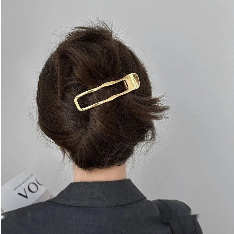 Women's zinc alloy hair barrettes in gold and silver with square, arc, and triangle shapes
