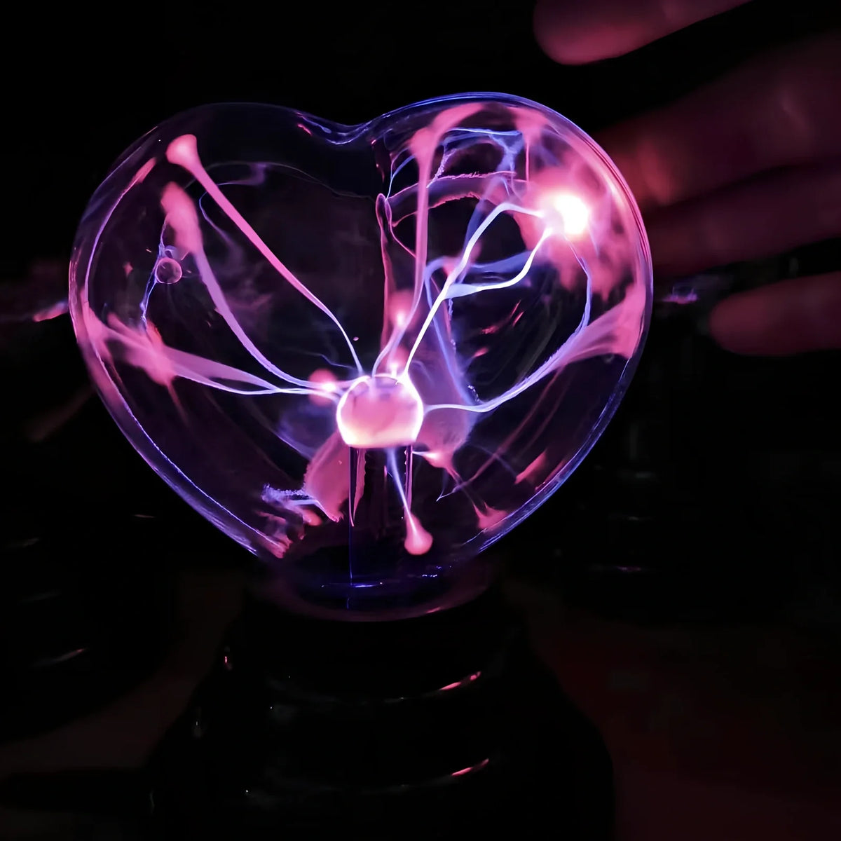 Plasma lightning ball with electrostatic induction showing colourful electrical discharges on glass surface