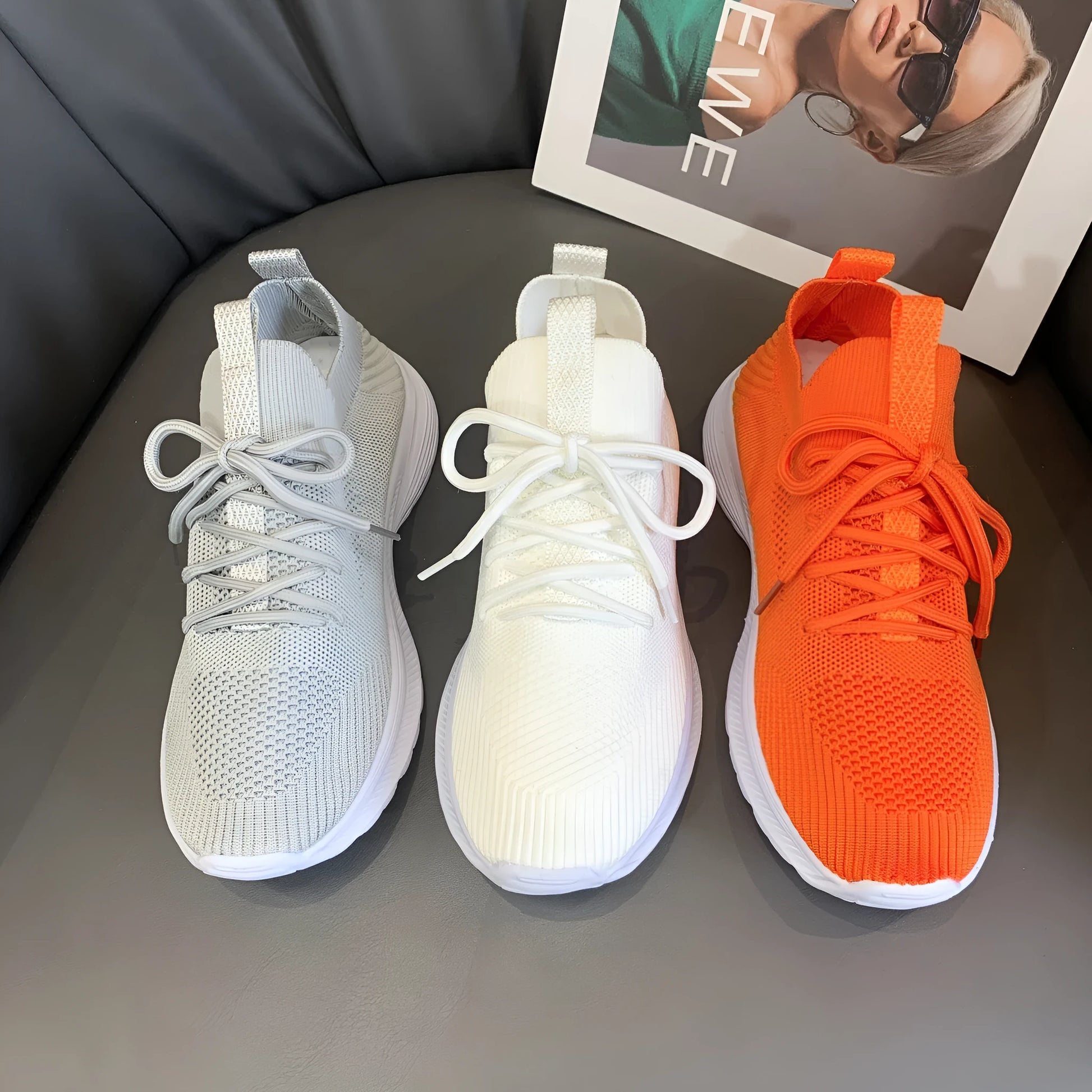 Women's Flyknit mesh running shoes in milky white with a low flat heel and rubber sole