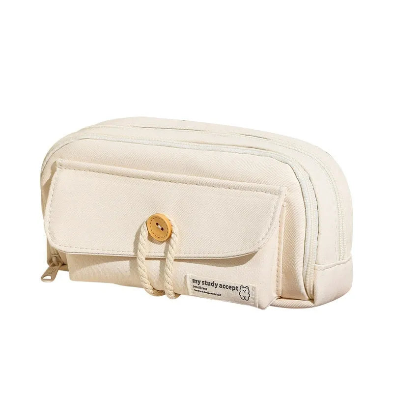 Korean style canvas pencil case with button closure, shown in beige, holding multiple pens.