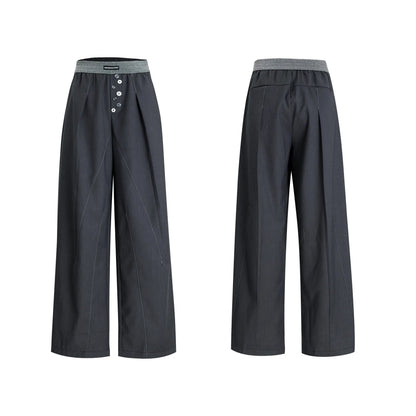 Straight-leg trousers with button-open line detail in black and grey colours, showing high-waist design and tailored silhouette