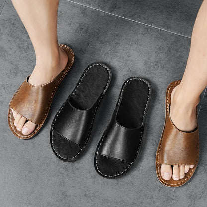 Brown leather men's sandals with a rubber sole on a neutral background