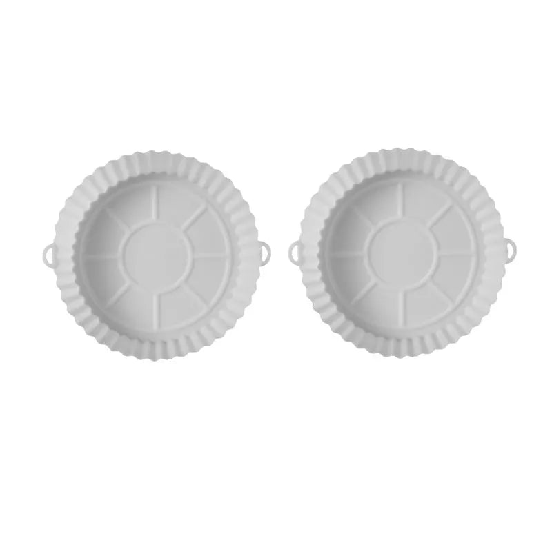 Round blue silicone baking tray mat with 4.5cm sides on a kitchen counter.