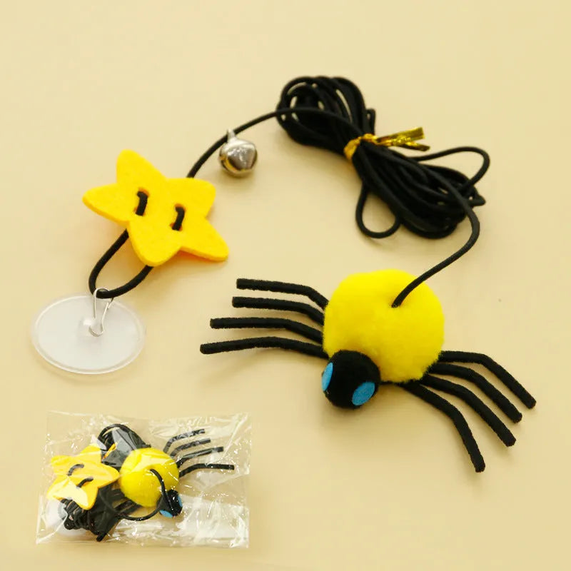 Red hanging door cat toy with elastic rope, feathers and spider-shaped bell mounted on door frame