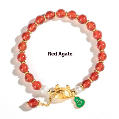 Natural agate and crystal bracelet with 8mm diamond-cut beads on a wrist.