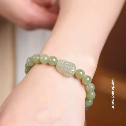 Women's polished Hetian jade ethnic bracelet showing 6mm, 8mm, and 10mm bead size options.
