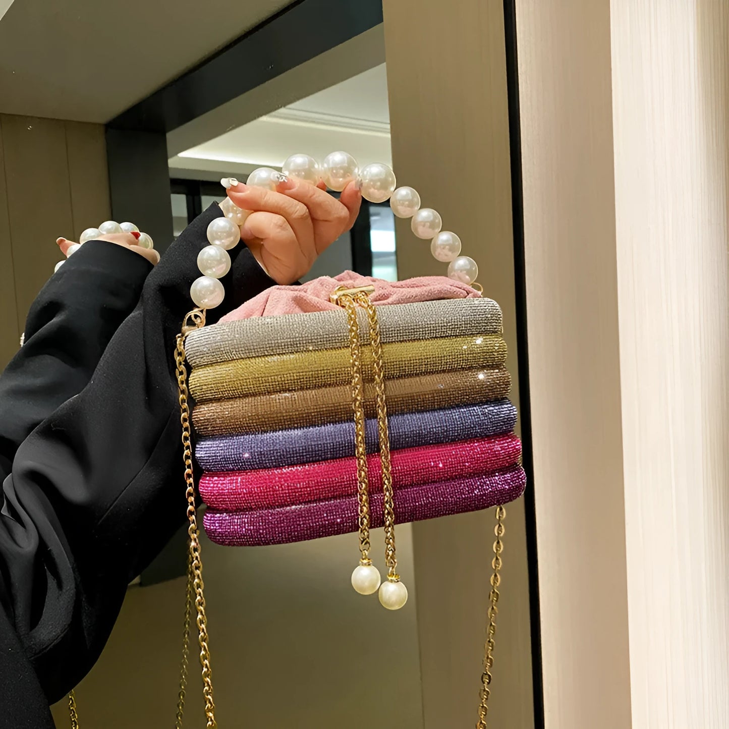 Women's one-shoulder crossbody bag with pearl beading, round shape, and internal zipper pocket in black colour