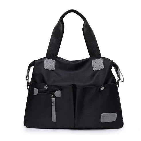 A fashionable and versatile ladies tote bag with multiple compartments and carrying options for the modern woman on the move.