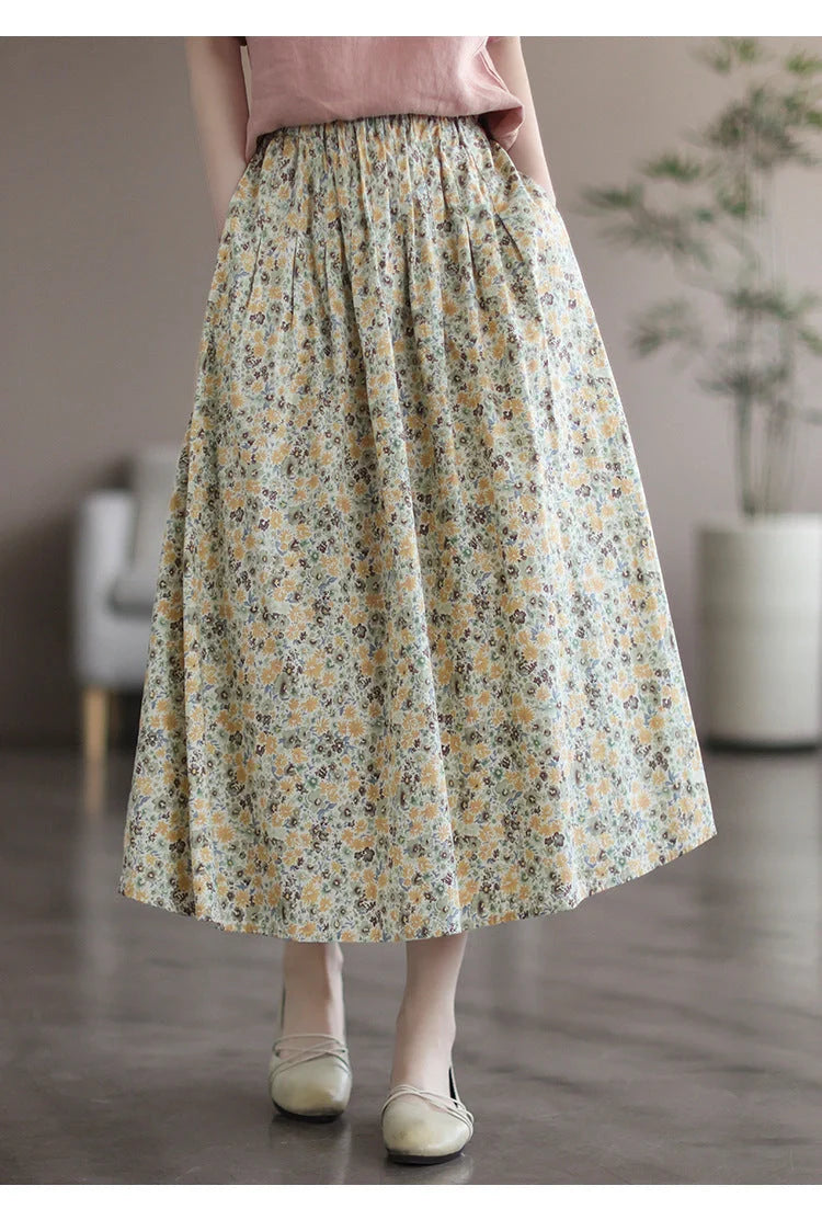 Elegant floral-printed cotton skirt with pleated design, available in yellow and blue flower patterns