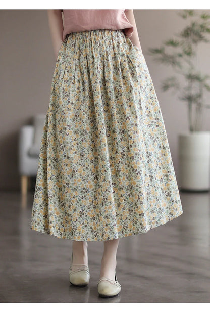 Elegant floral-printed cotton skirt with pleated design, available in yellow and blue flower patterns