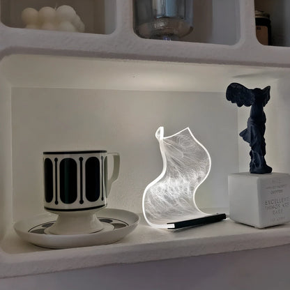 USB-powered bedside lamp with three colour settings and compact design