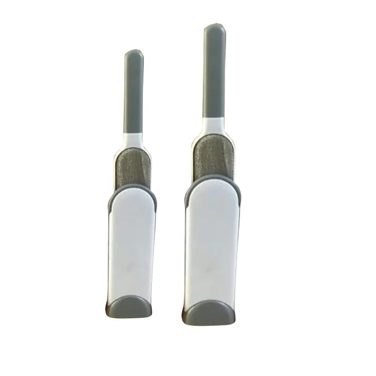 Blue reusable pet hair removal brush with double-sided head next to its self-cleaning base.