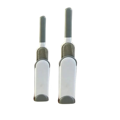 Blue reusable pet hair removal brush with double-sided head next to its self-cleaning base.