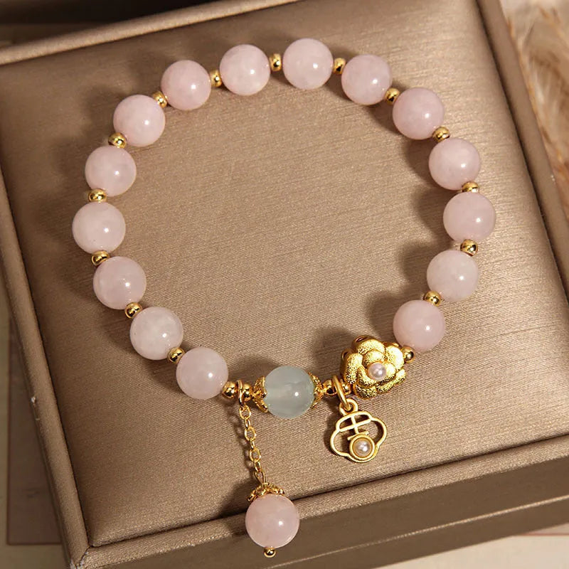 Women's pink crystal flower bracelet with adjustable sizing and refined grace floral design
