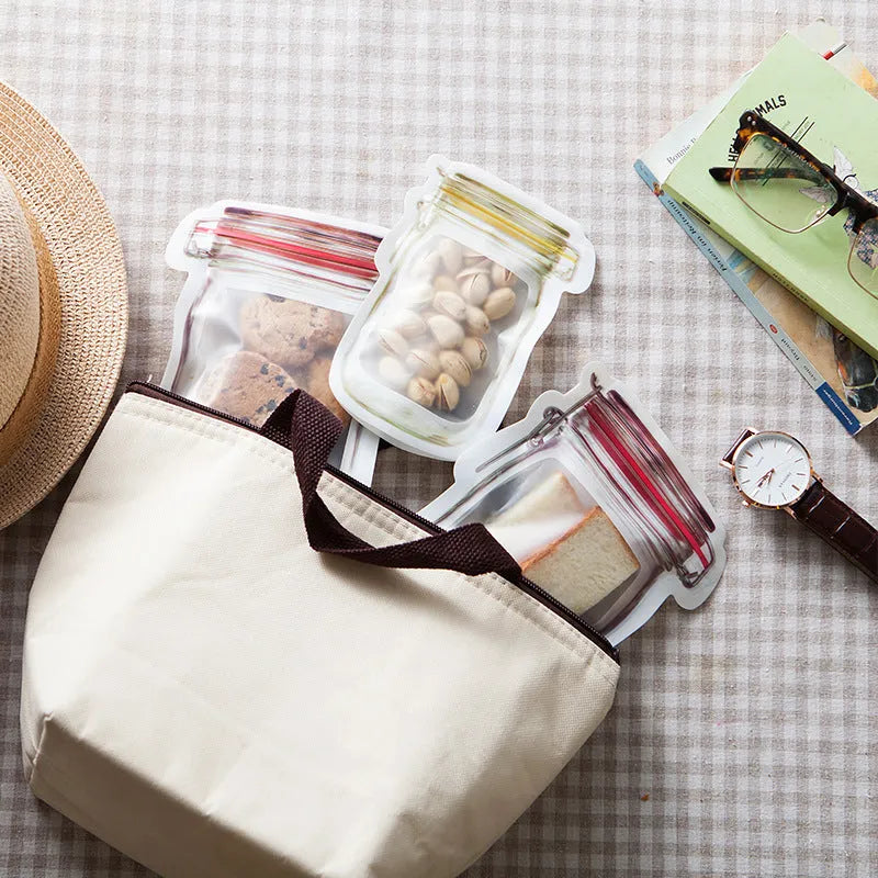 Red reusable self-sealing plastic bag for snacks with zipper closure, shown with biscuits.