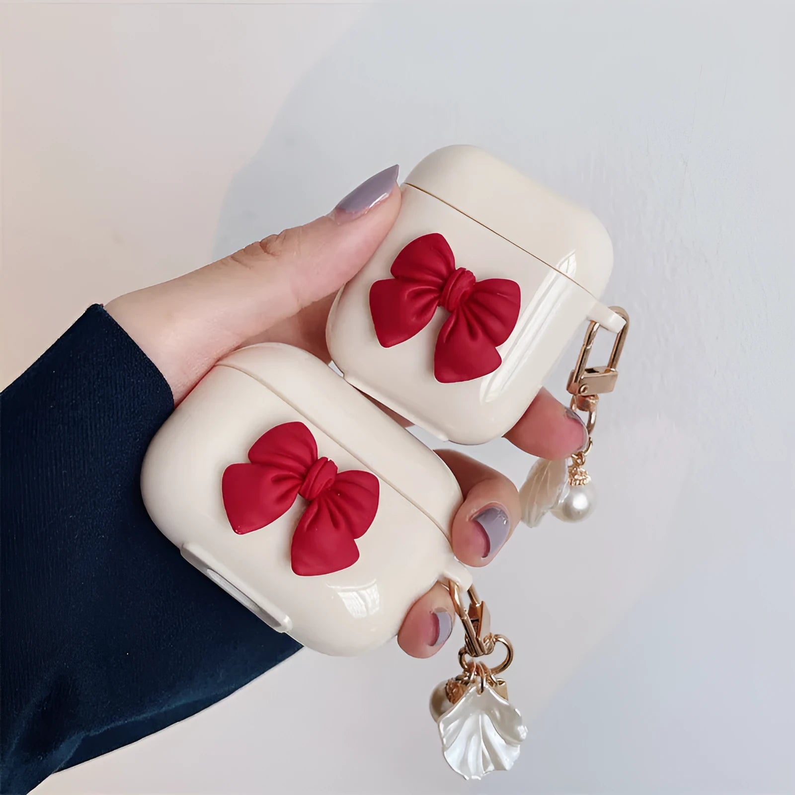 Beige red bow shell patterned TPU clamshell protective case for AirPods Pro earphones.