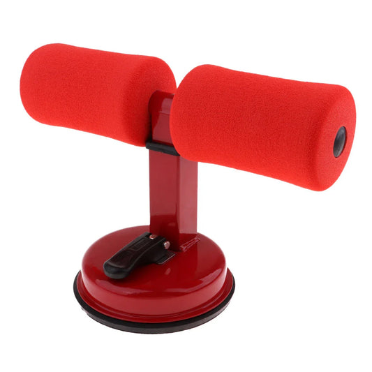 Compact sit-up strength trainer with steel springs and foam padding for home fitness
