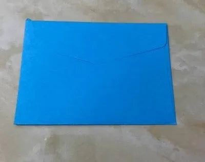 Mini coloured paper envelopes in various hues measuring 11.5 by 8 centimetres