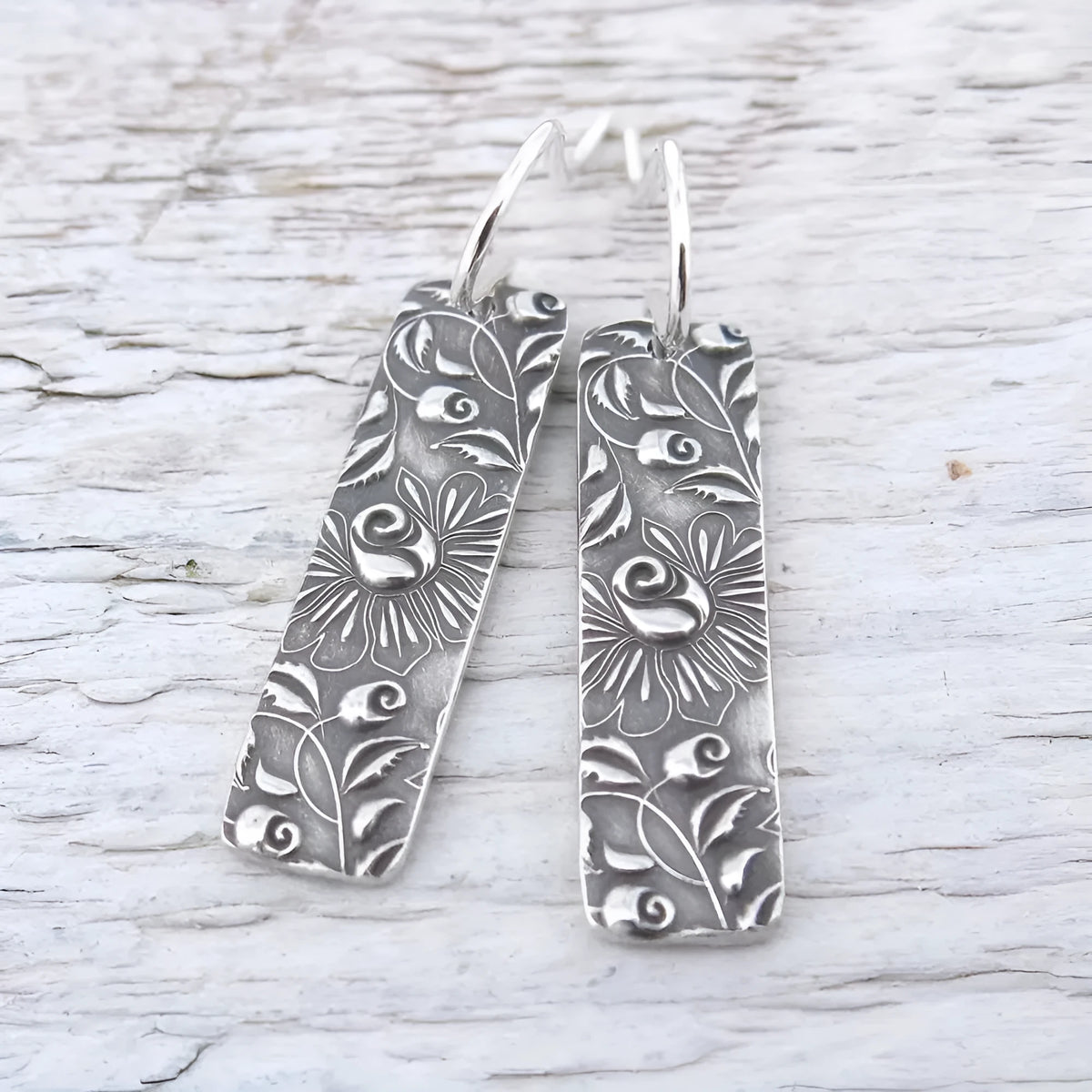 Geometric long earrings with carved vine pattern in silver zinc alloy