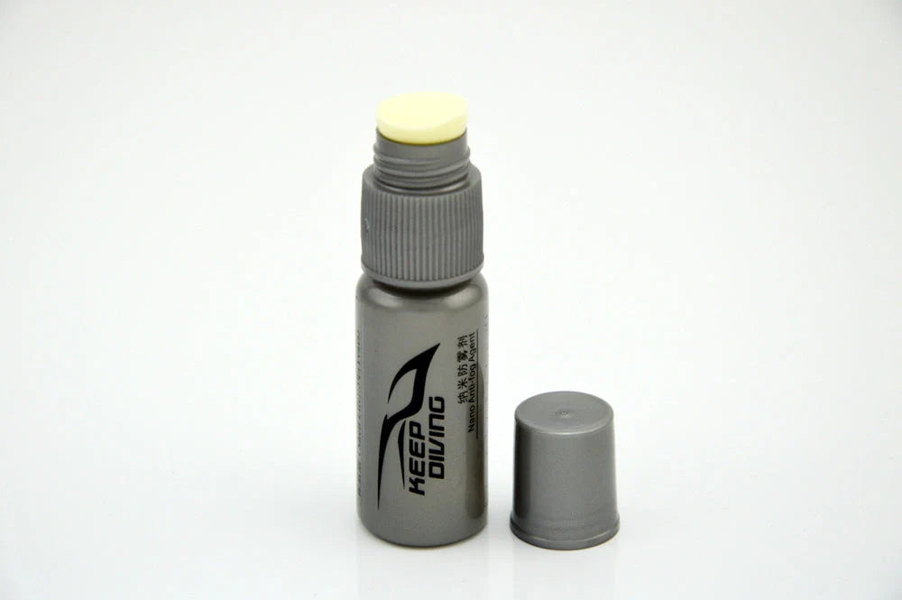 Anti-fog liquid bottle with spray nozzle for eyewear fog prevention