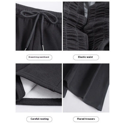 Women's high waist bootcut sports pants in black cotton with fleece lining and micro elasticity, slightly flared leg.