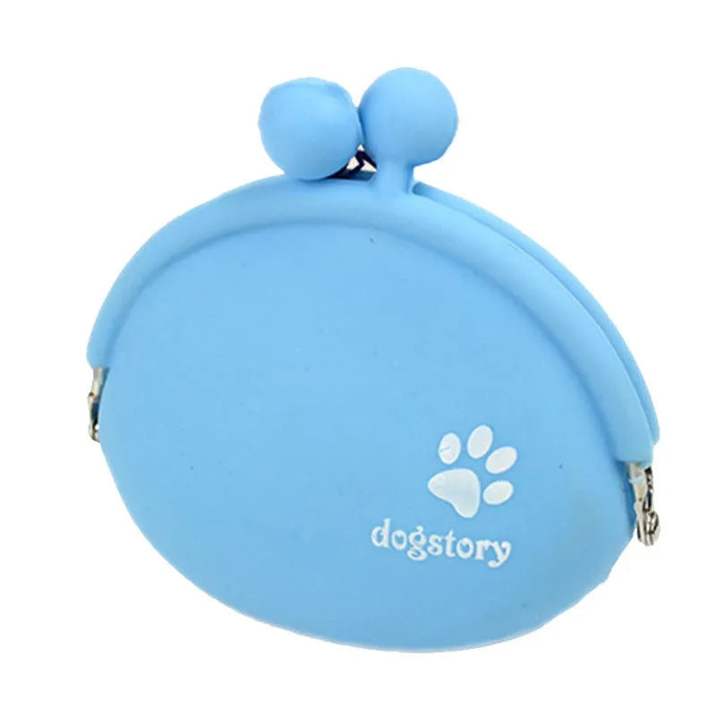 Yellow silicone dog training treat pouch with hook and loop closure, shown on a waistband.