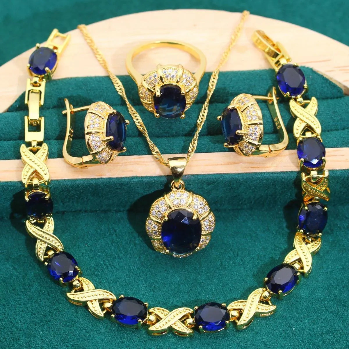 18k gold plated jewellery set with multi-colour zircon stones showing necklace, earrings, ring, and bracelet