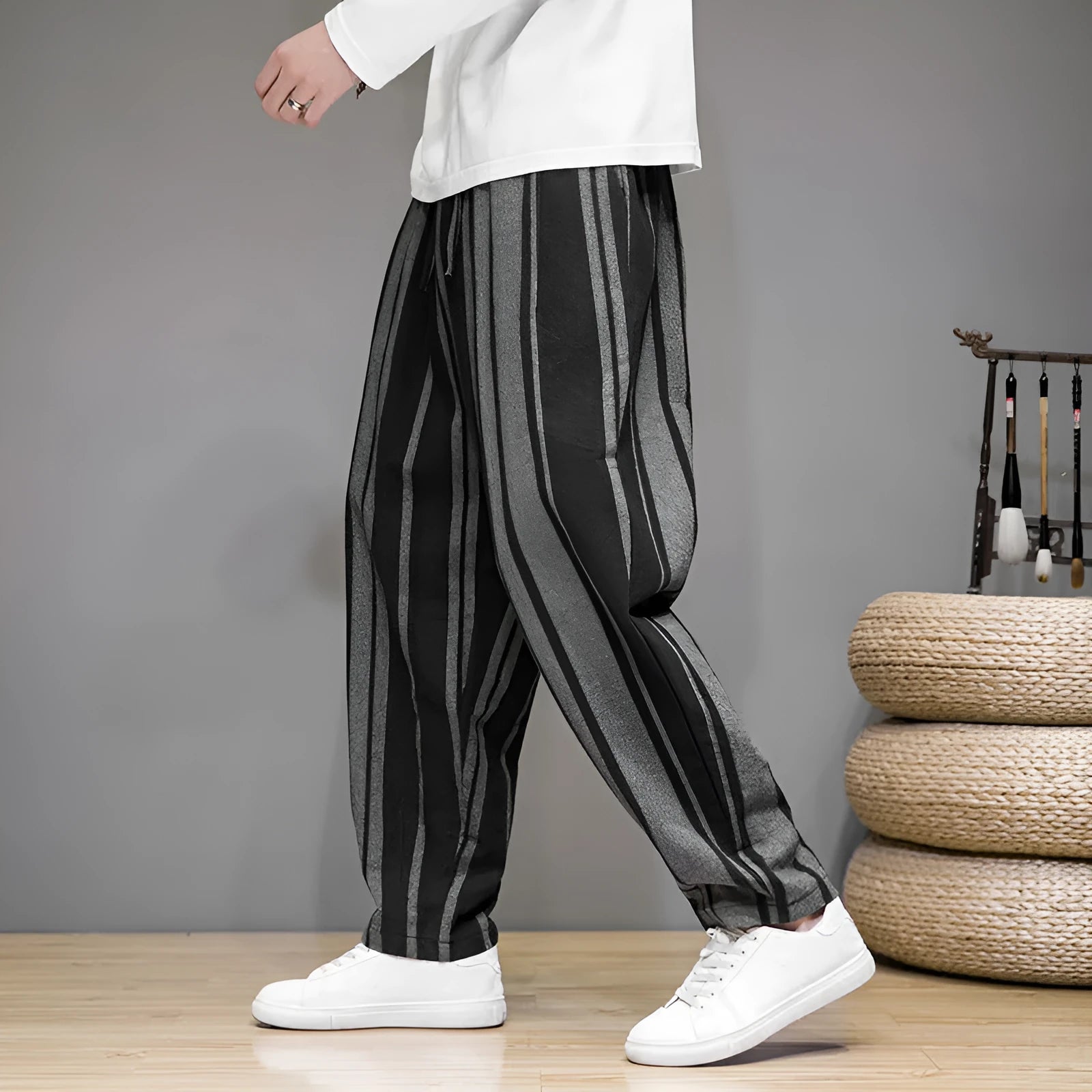 Navy blue and black striped men's casual trousers with a non-elastic waistband laid flat.