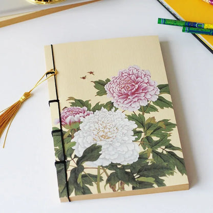 A5 antique wire-bound notebook with classical artwork cover, black oil wax rope binding, and decorative tassels