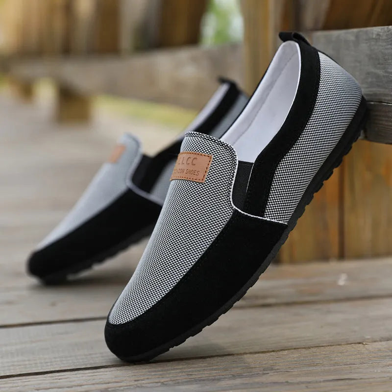 Men's grey canvas lace-up casual shoes with a round toe and rubber sole.