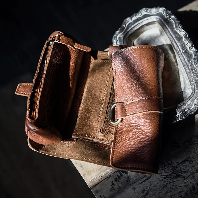 Handmade vintage leather wallet in black or dark brown with tape closure.