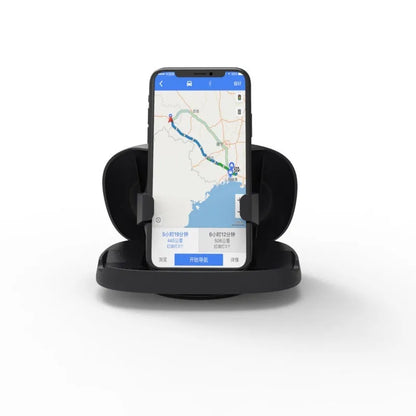 Black plastic rotating suction cup car navigator bracket mounted on a car windscreen