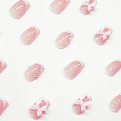Fashion short white French cute bow manicure set with 24 nail art pieces including tulip, bow, starry sky, leopard print, and XINGX designs.