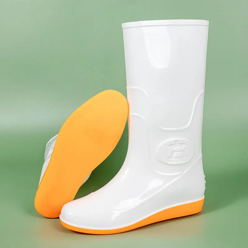 Plastic washable rain boots in white and yellow colours showing high tube Wellington-style design